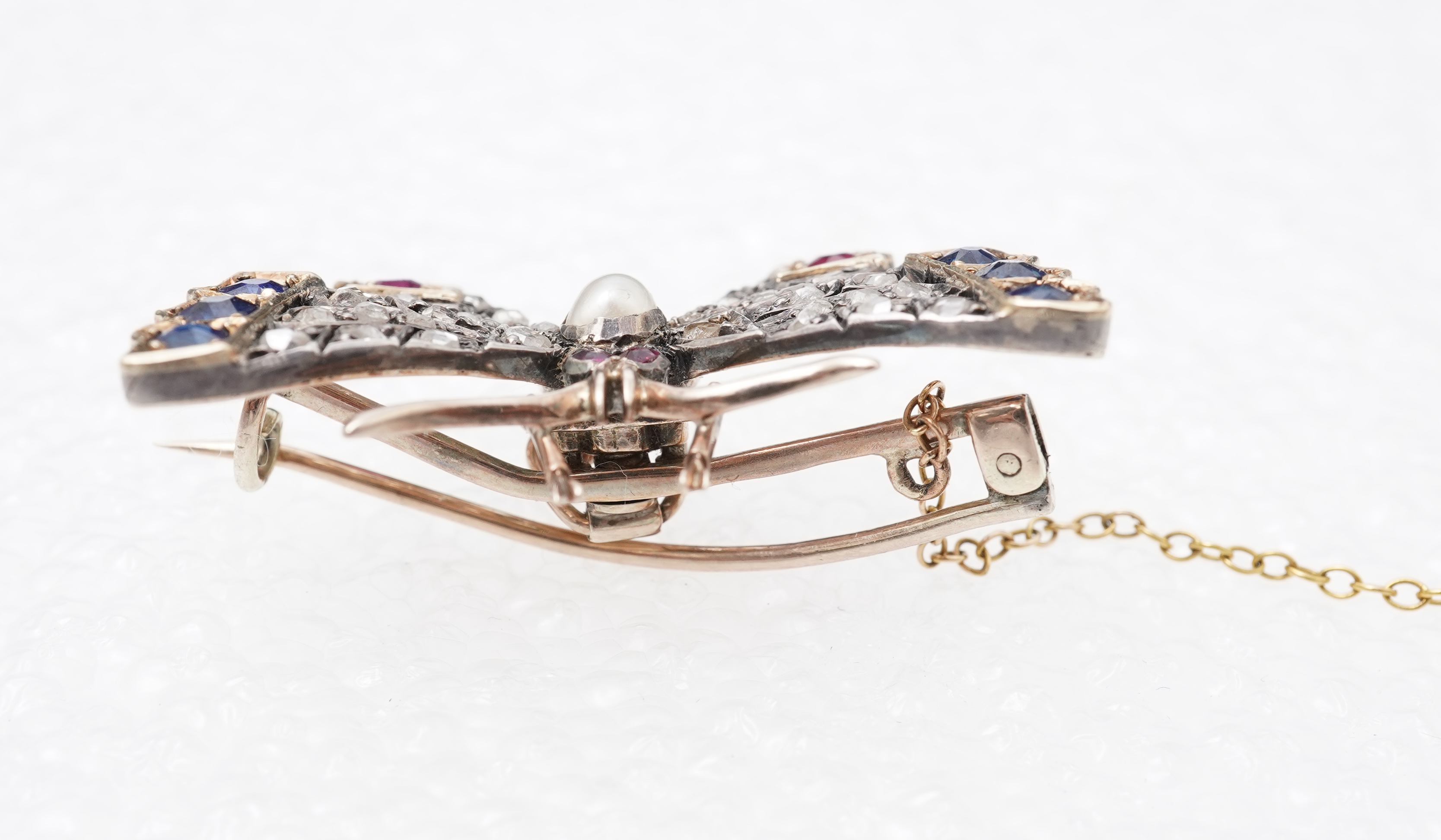 A Victorian ruby, sapphire, pearl and diamond brooch, late 19th century